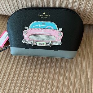 A decorative small Kate Spade bag.